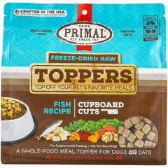 Primal Pet Foods dog toppers with fish pack open; boosts flavor and omega-3 for training sessions.