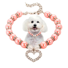 PSPORT pearl necklace with heart pendant on cat model for festive pet flair.