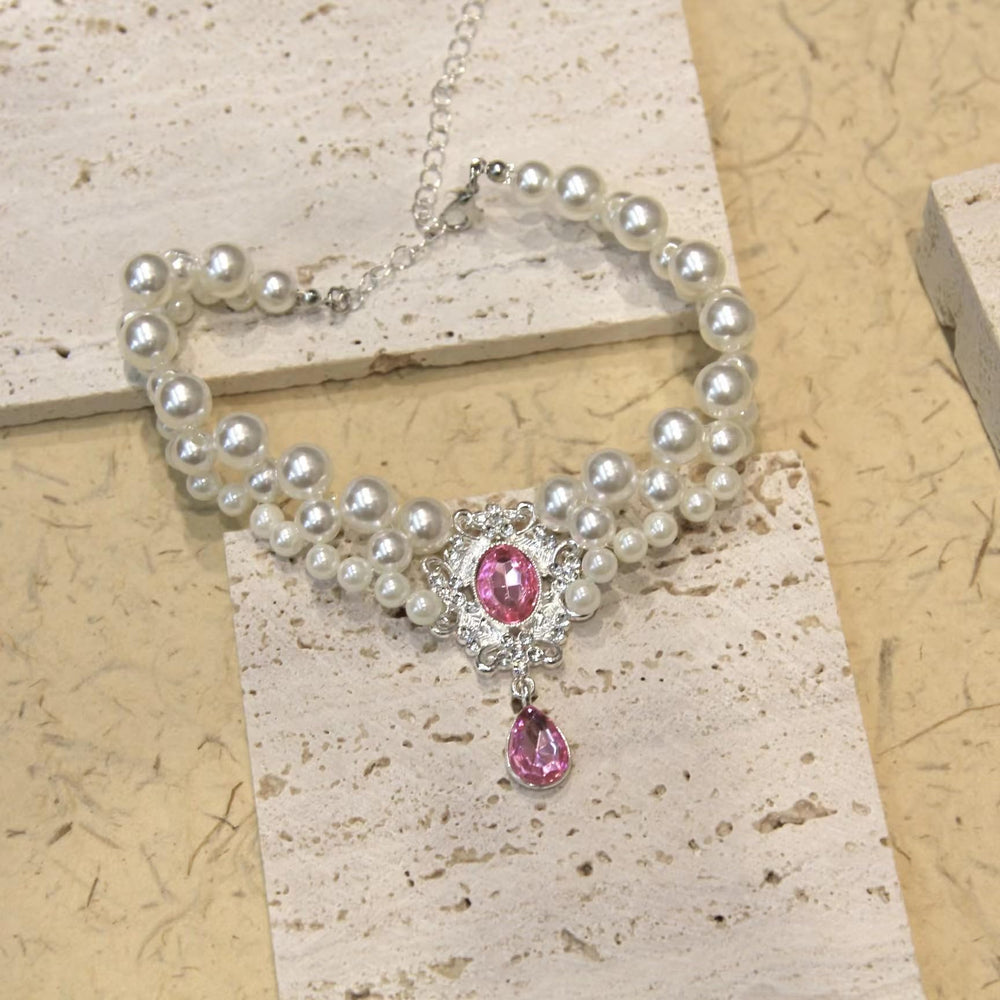 PTWSF Pearls collar pink XS on-cat view shows secure, comfortable fit for small pets