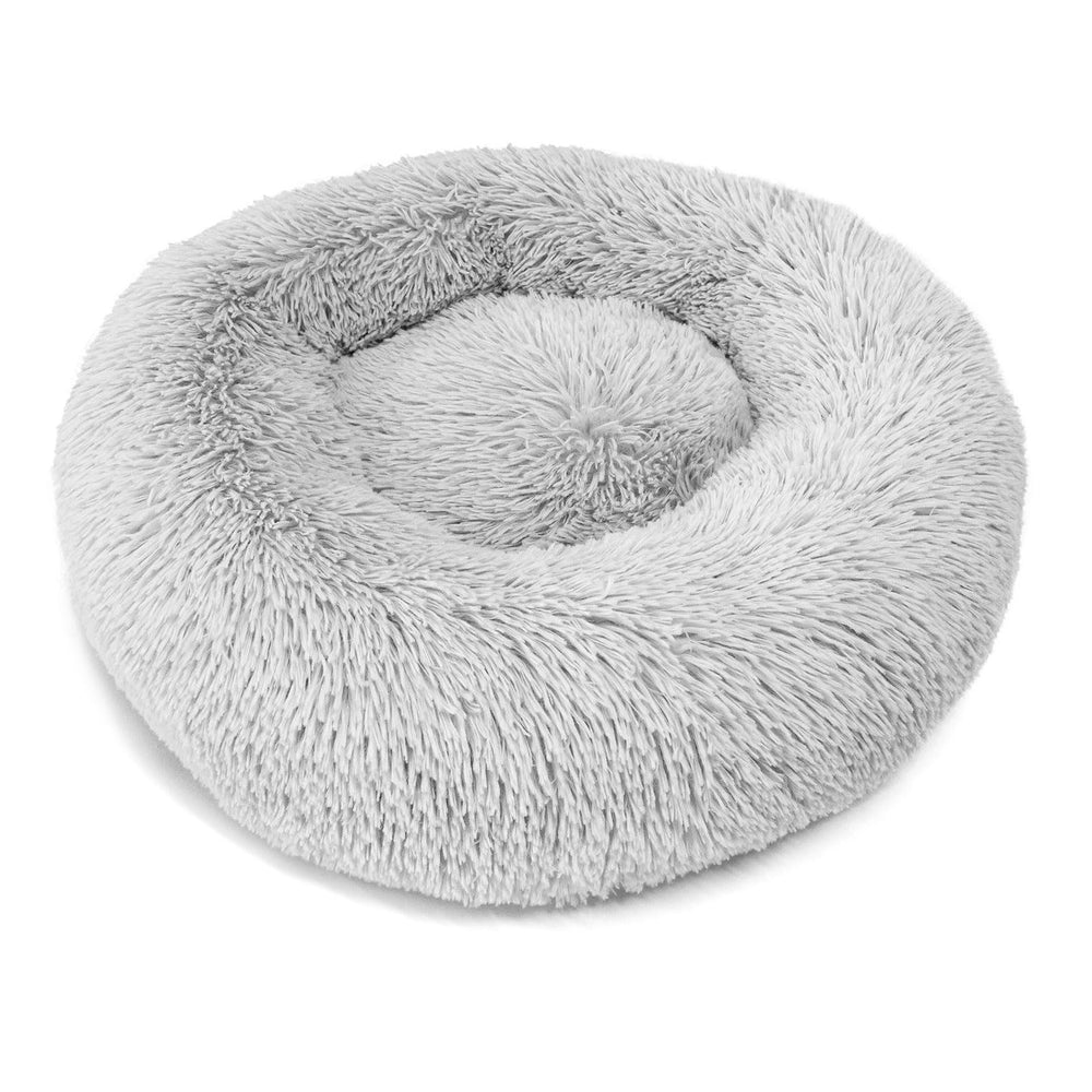 Qinxuepet donut bed fits on floors and boosts stability on slick surfaces.