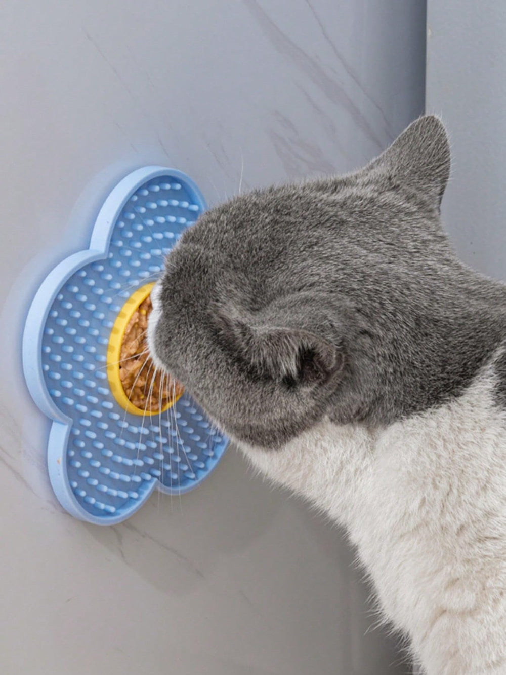 QWINEE lick mat for cats, blue flower style, enhances slow feeding.