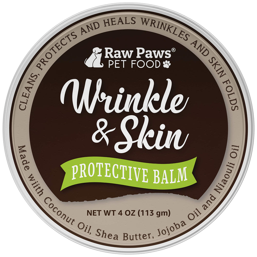 Raw Paws wrinkle and skin balm application on dog face demonstrates soothing care for sensitive skin.