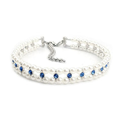 RayMinsino Pearl Rhinestone Collar sparkles on a pet, ideal for weddings and festive occasions.