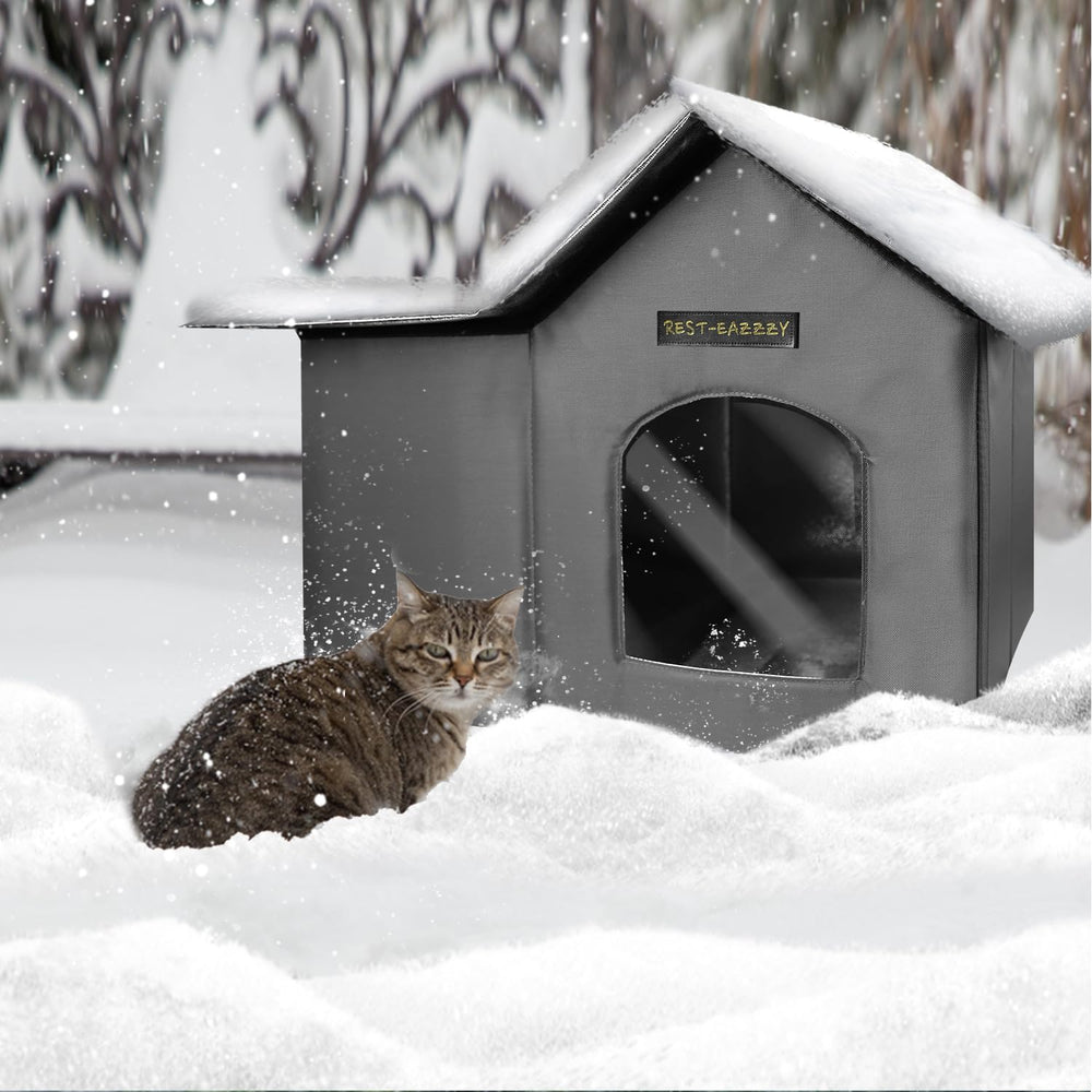 Rest-Eazzzy outdoor cat house in use with a resting cat.