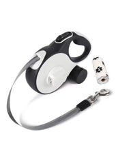 Retractable dog leash with LED light 16ft illuminating night walks for safety.