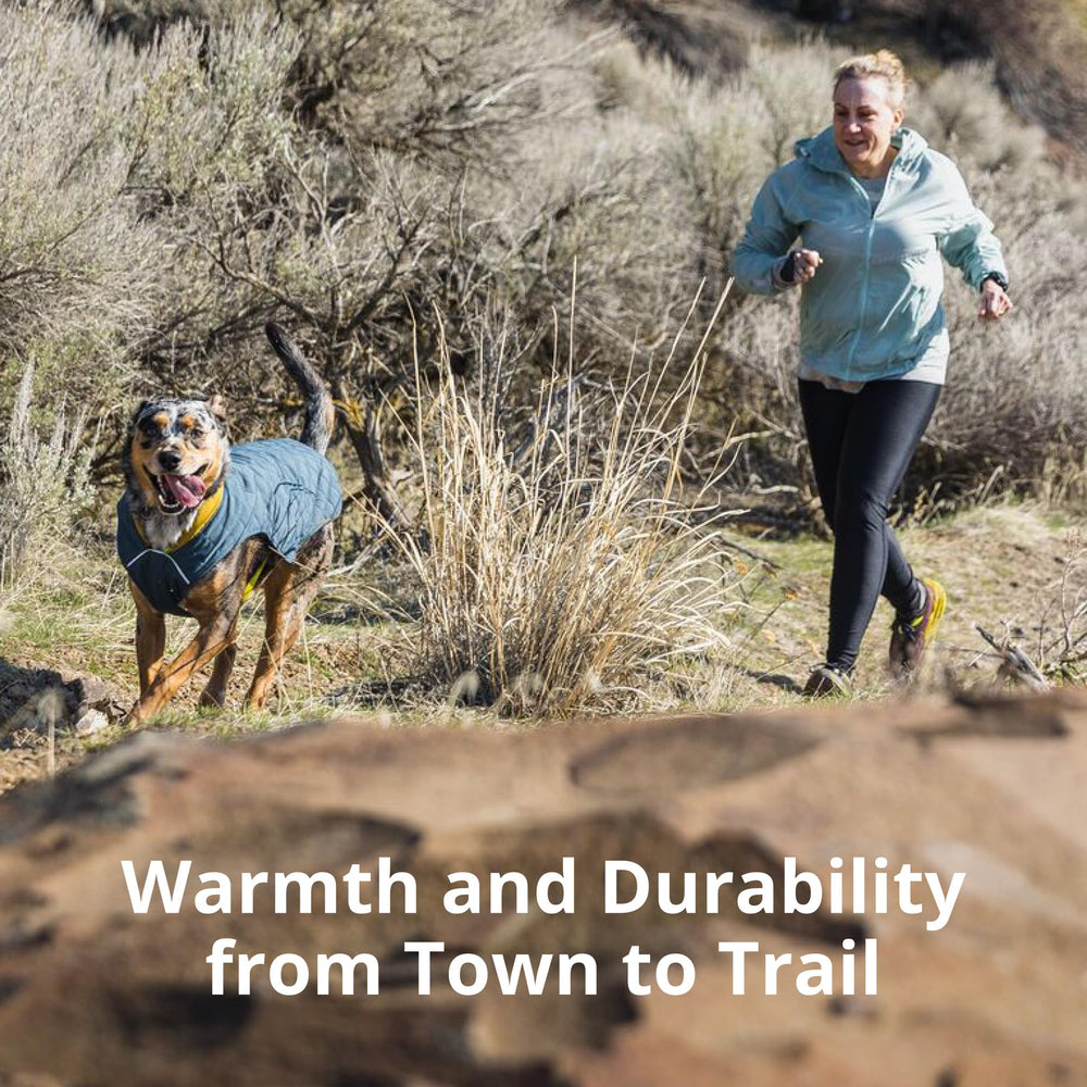 Ruffwear Stumptown Jacket back with leash portal facilitates clean harness transitions.