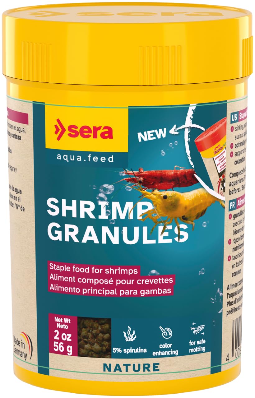 Sera Shrimp Granules pouring—tiny sinking bits designed for natural grazing and growth