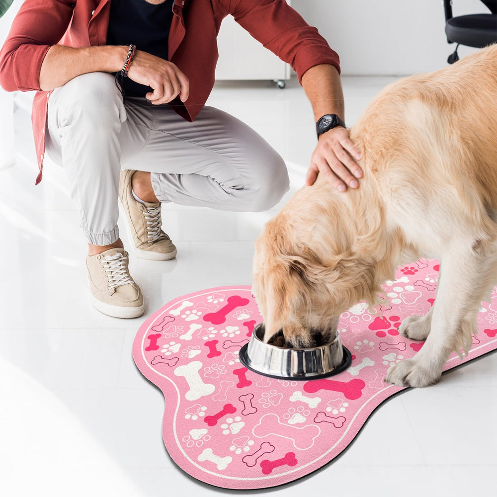 SHUNLCD bone-shaped mat under automatic feeder keeps eating area tidy.