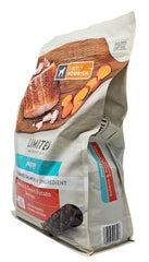 SIMPLY NOURISH salmon kibble close-up emphasizes high-quality protein for growing puppies.