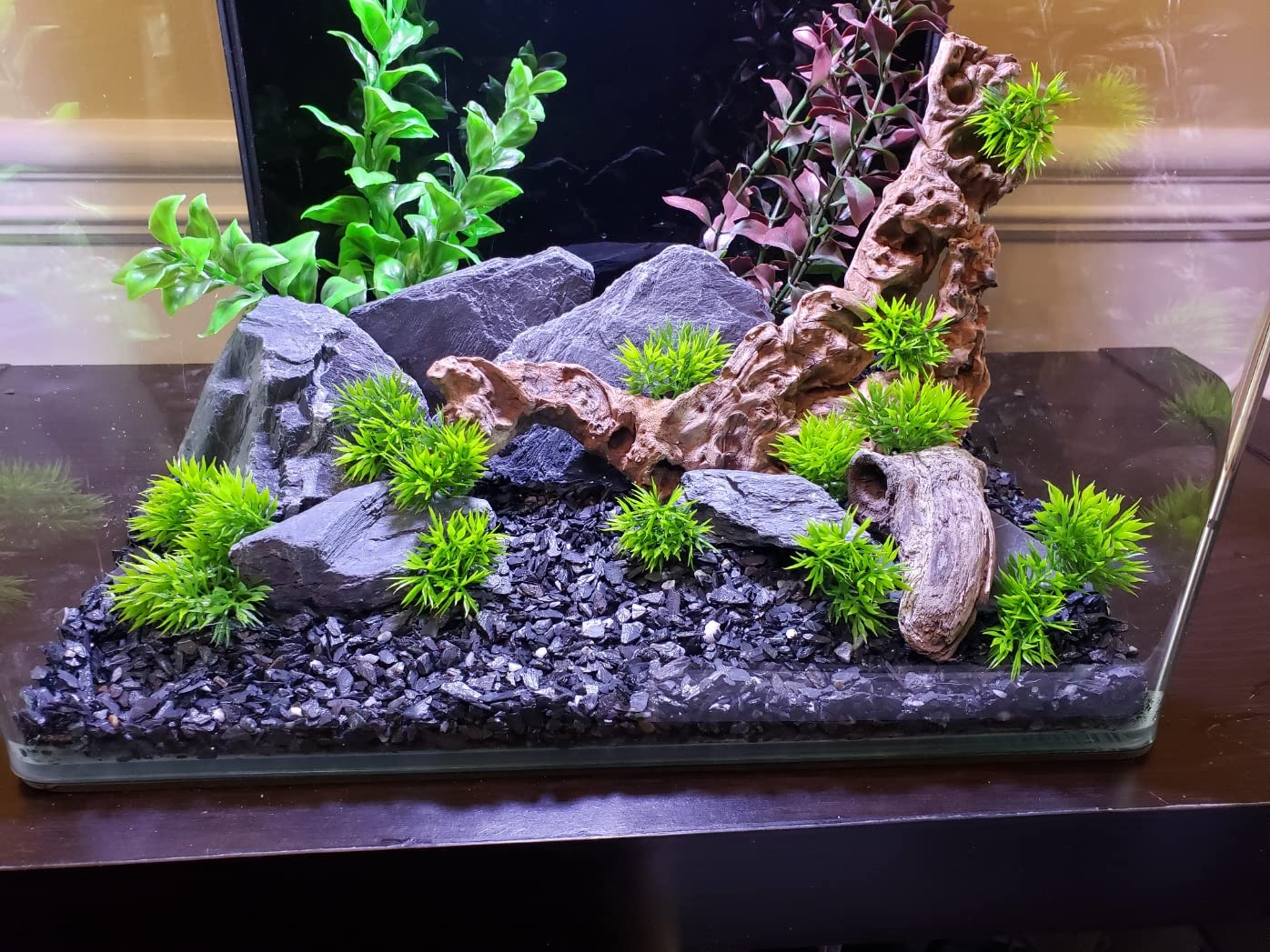 Small World Slate driftwood-attachment creates stable caves and climbing surfaces.