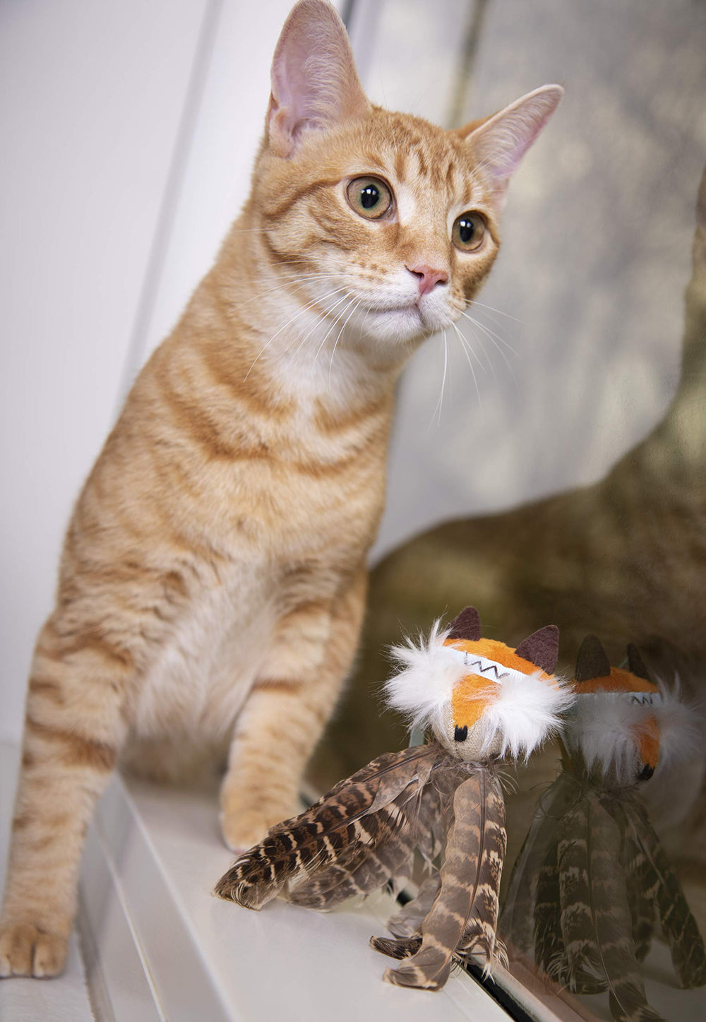SmartyKat Toss-A-Fox white feathers-closeup emphasizes tactile textures that invite swiping.