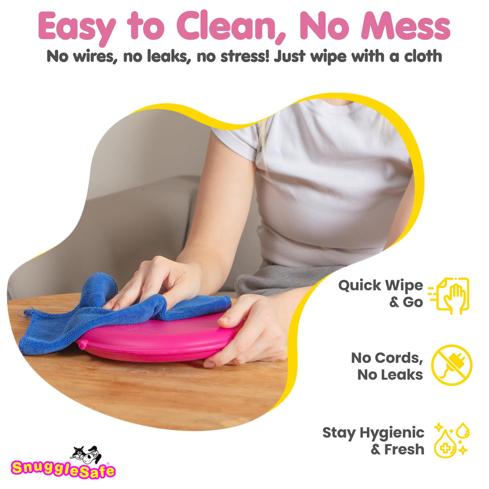 Snugglesafe Original heat pad used by dogs and cats for cozy resting.