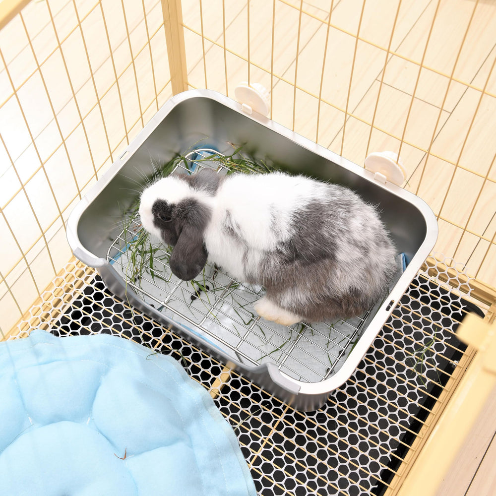 Sorstrem litter box fits inside rabbit caging for cleaner space.