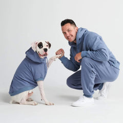 Spark Paws human hoodie with drawcord hood enhances adjustable warmth during outdoor activities.