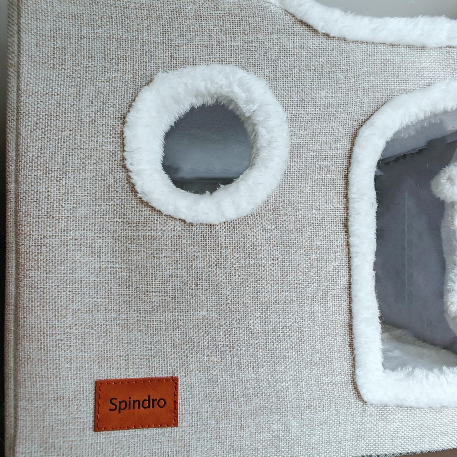 Spindro cat cave bed beige fabric blends with home interiors.