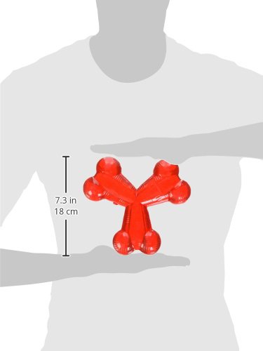 SPOT Trident Bone toy mid-air fetch during outdoor play