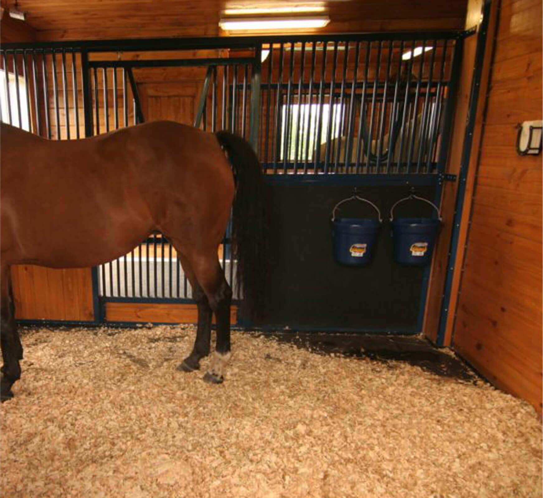 SUKEYME bucket hook in use prevents bucket tipping in stall