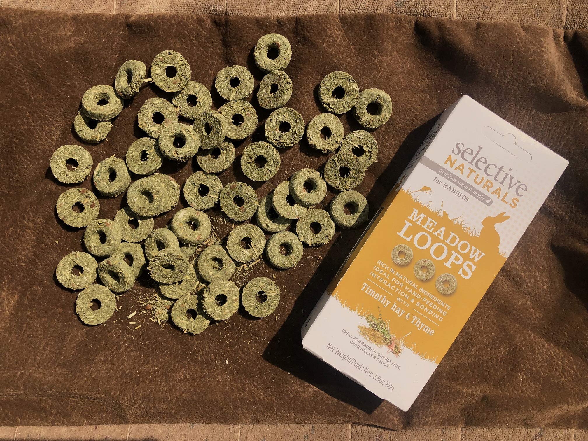 Supreme Meadow Loops closeup with Timothy Hay and Thyme, natural ingredients snack for pets.