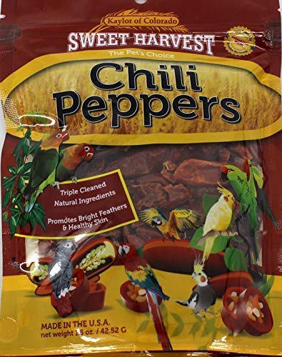 Sweet Harvest chili peppers treat bag close-up showing vitamin-enriched snacks for birds.