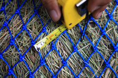 T TEKE Ultra Slow Hay Net full capacity illustration for horses and goats.