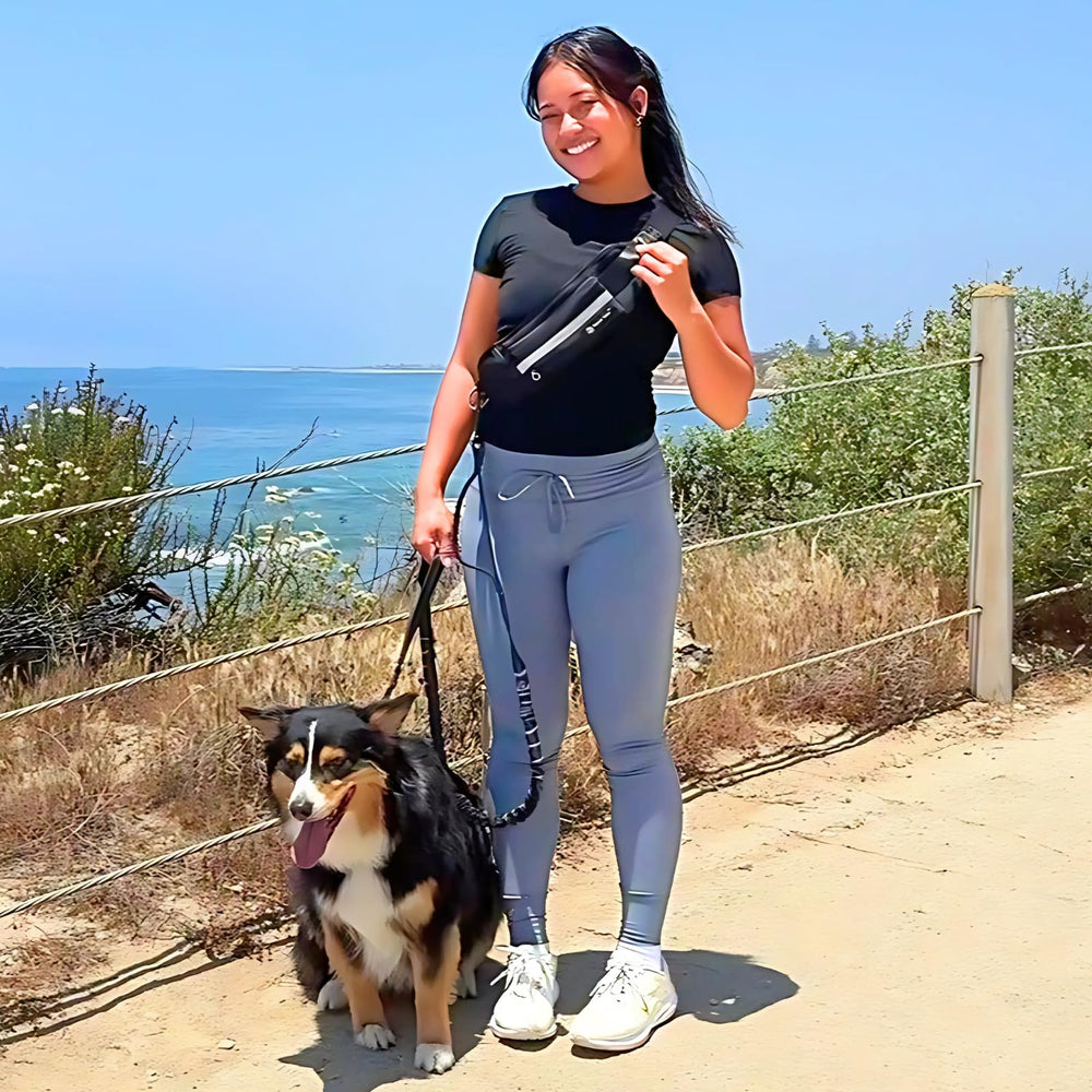 Tails & Tales hands-free waist leash bungee stretch demonstrates shock-absorb design for smoother walks.