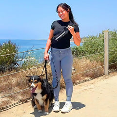 Tails & Tales hands-free waist leash bungee stretch demonstrates shock-absorb design for smoother walks.