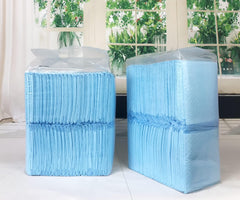 TBM Puppy Pads absorbent layer shown to lock moisture during potty training.