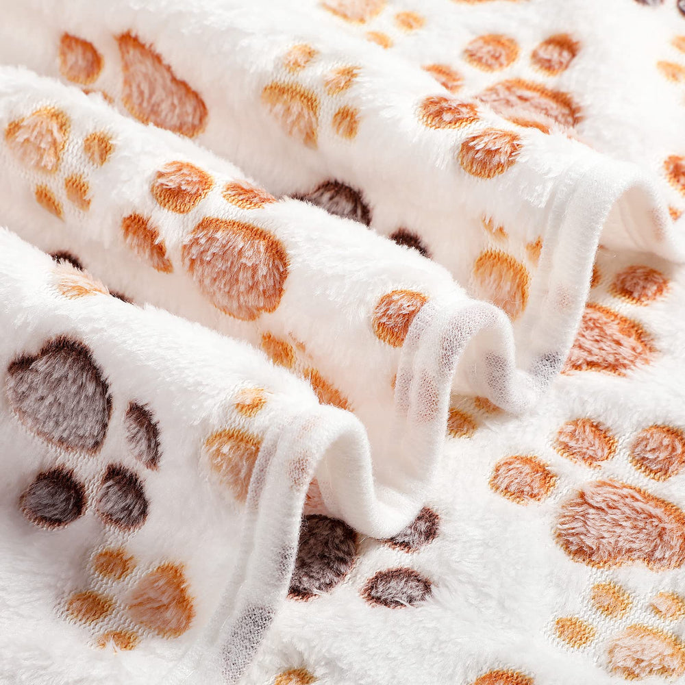 Tegeme double-sided fleece blanket folded in a crate for easy bedding.