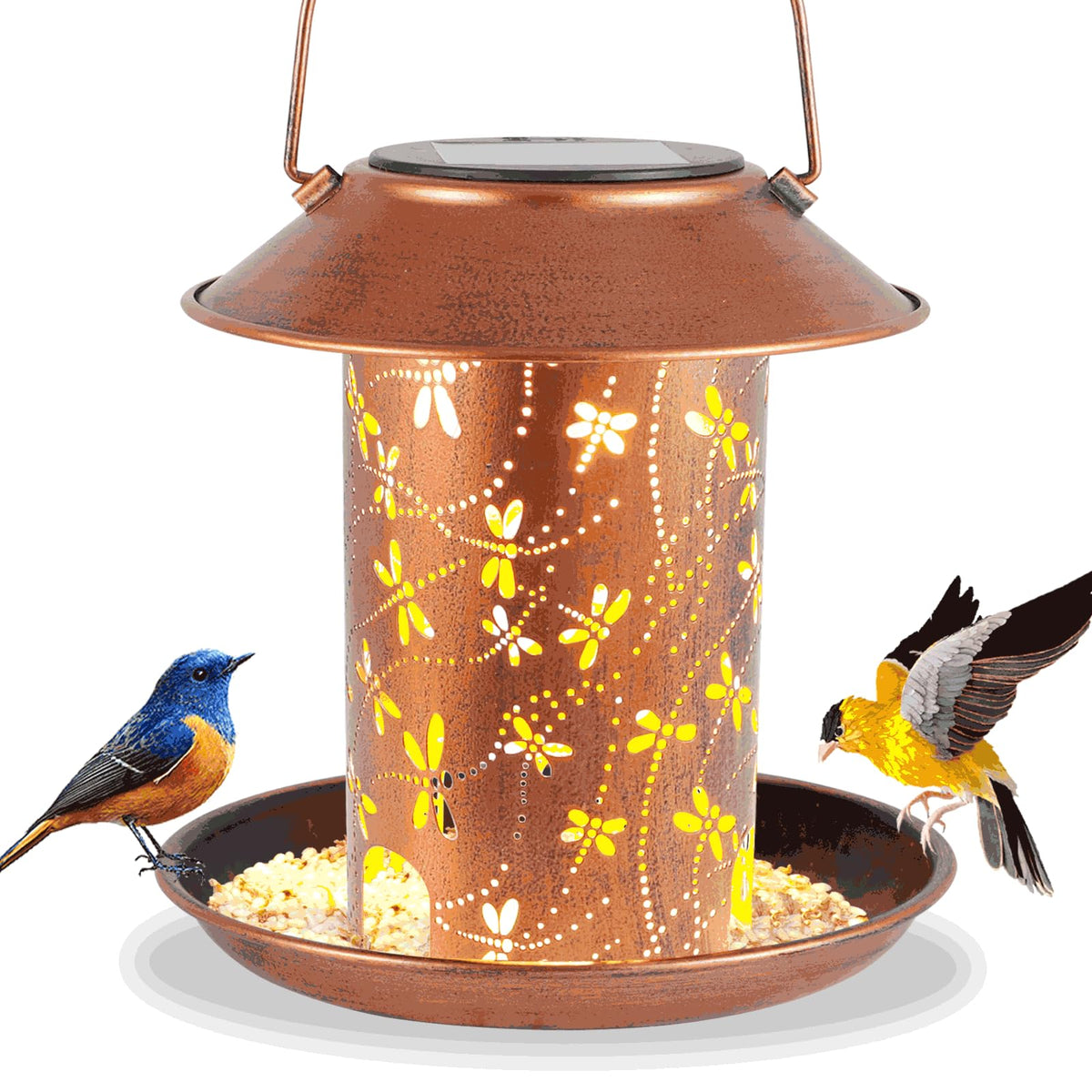 Tepaken dragonfly solar lantern bird feeder casting warm garden glow at dusk.