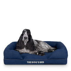 The Dog's Bed waterproof cover in denim protects accidents while keeping joints supported.