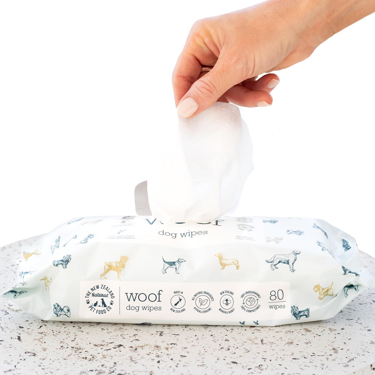 the-new-zealand-natural-pet-food-co Woof Dog Wipes packaging shows plant-based, eco-friendly design for pet care.