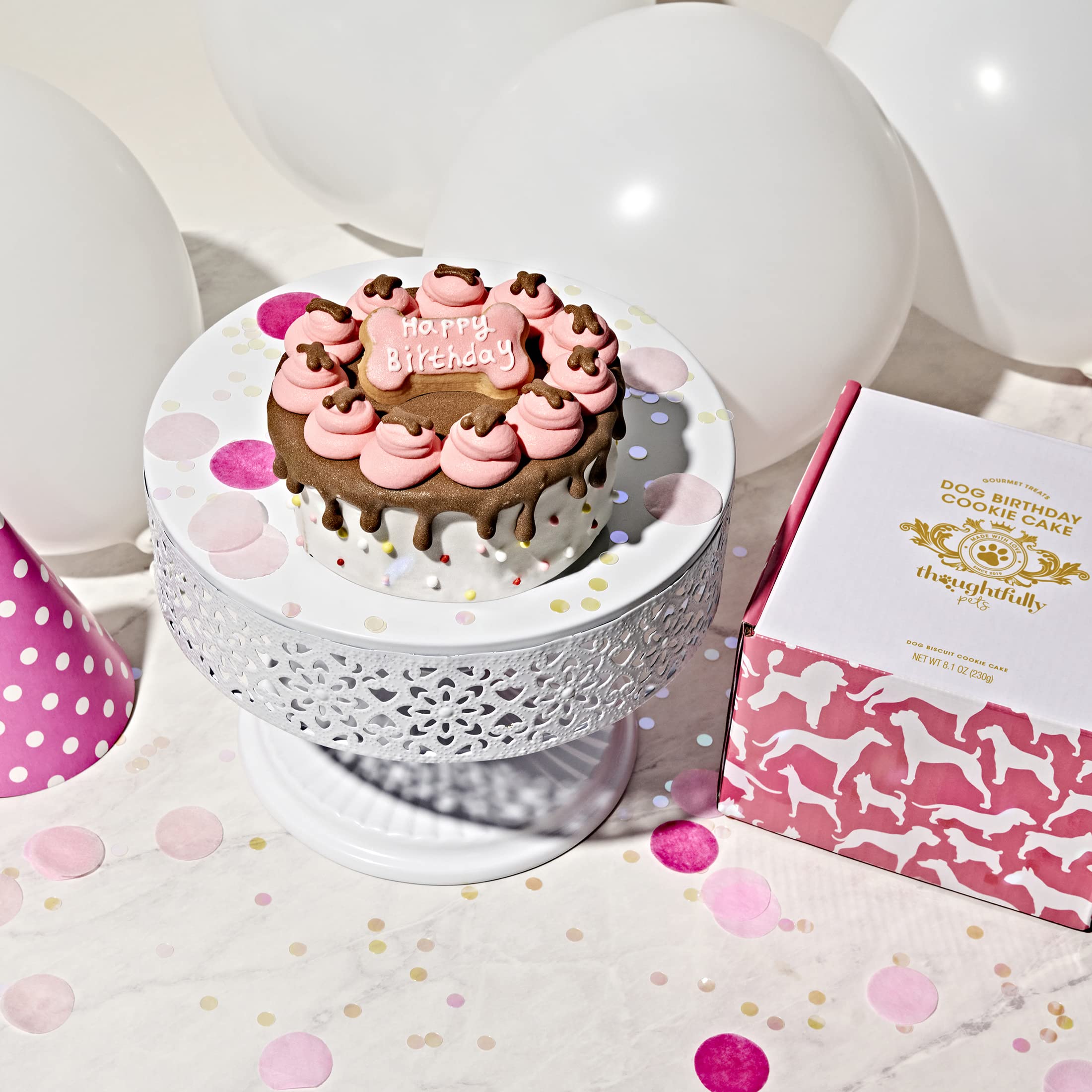 Thoughtfully Pets puppy party scene with pink cake for celebrations and fun.