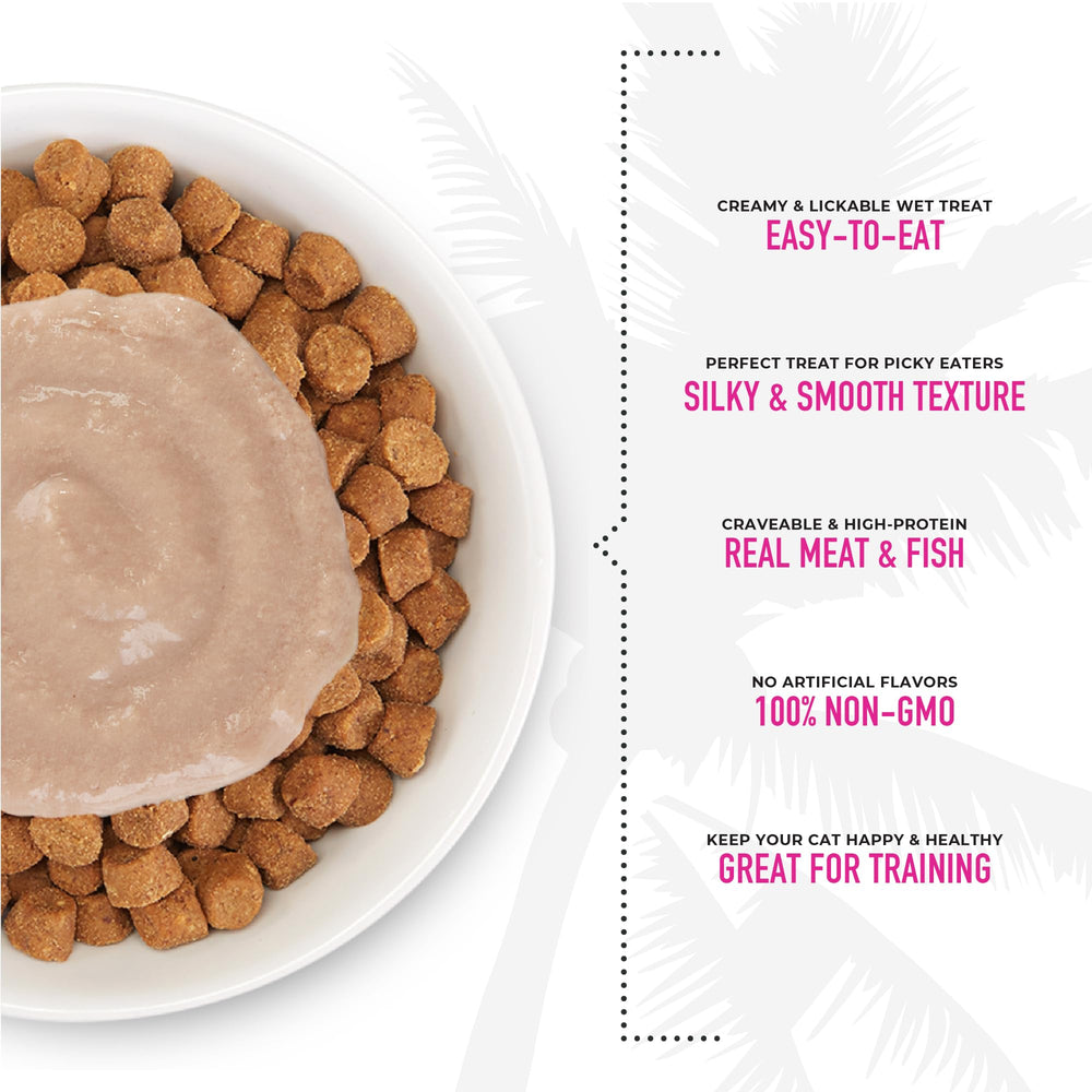 TIKI PETS Cat licking Tiki Cat Stix Mousse Treats close-up.