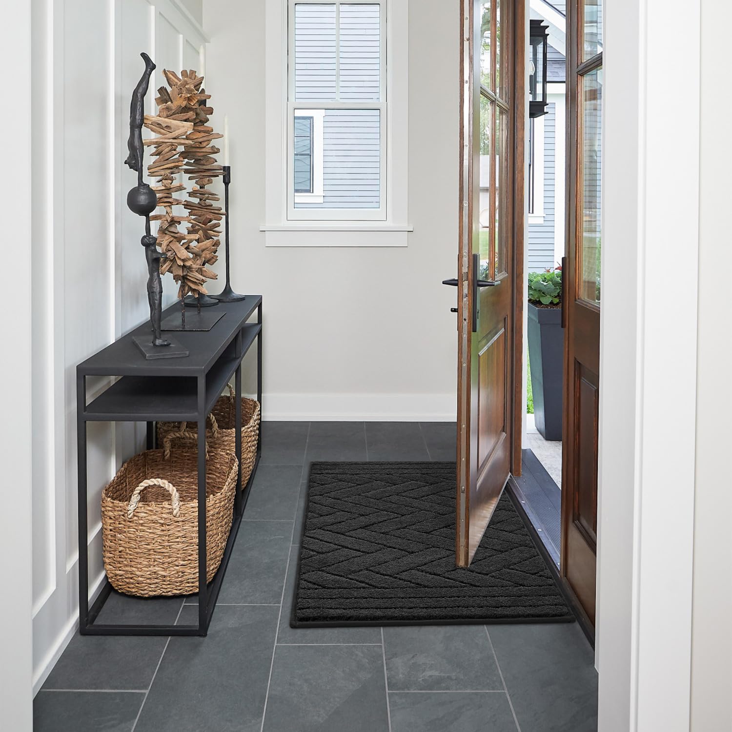 Tindbea low-profile 0.4-inch dog mat fits doors smoothly and stays in place.