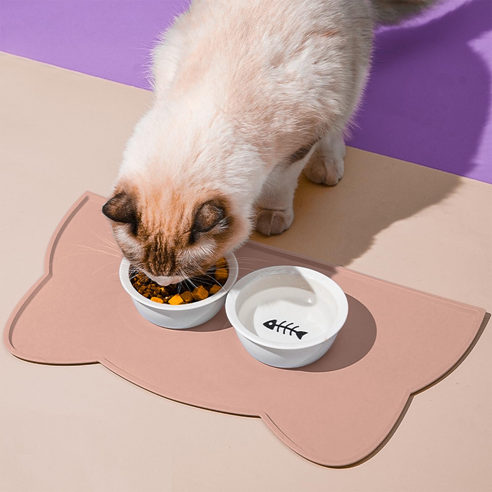 TOKAYIFE cat food mat with raised edges keeps spills on mat.
