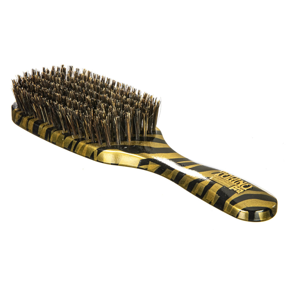 Torino Pro Wave Brush in hand for daily brushing routine
