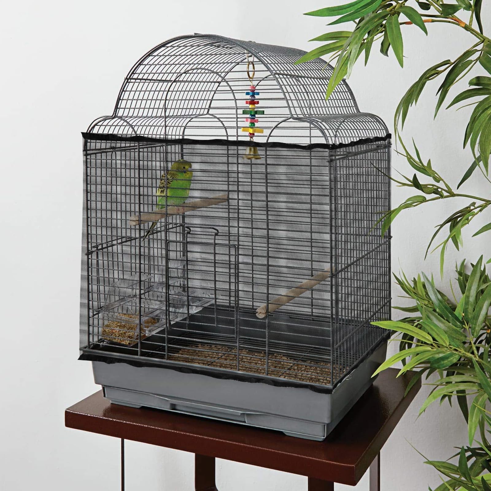 Trinkrittey black seed catcher on parrot cage blends with decor