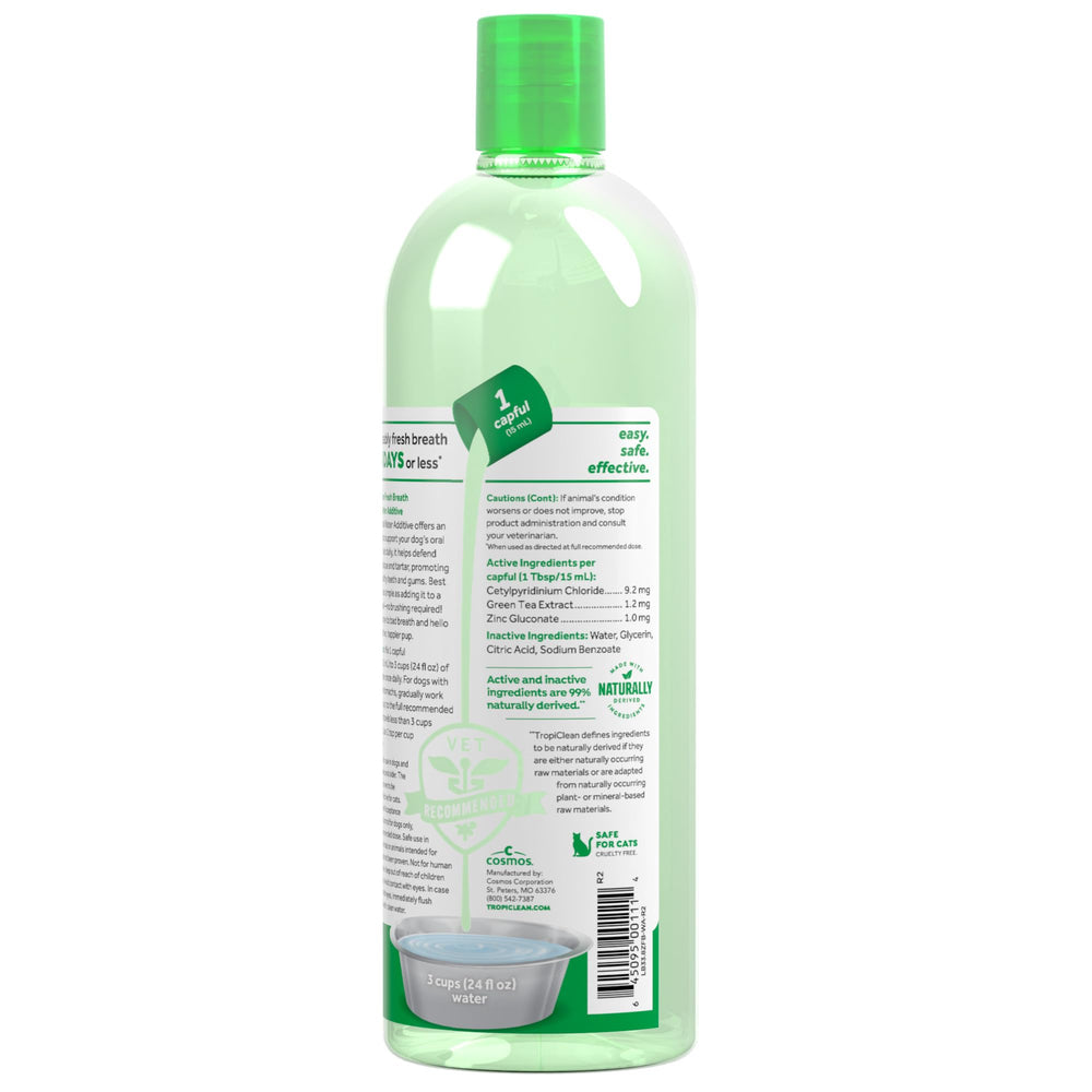 TropiClean Fresh Breath Water Additive measuring cup demonstrates easy half-dose guidance for sensitive stomachs.