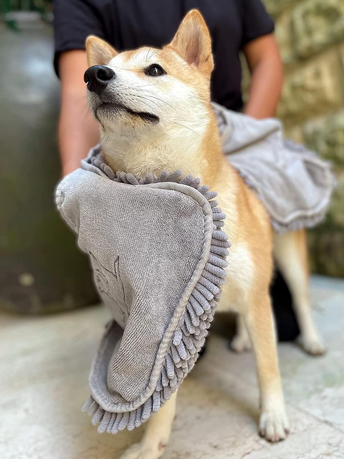 Tuff Pupper noodles massage and wick water from fur for a gentle dry.