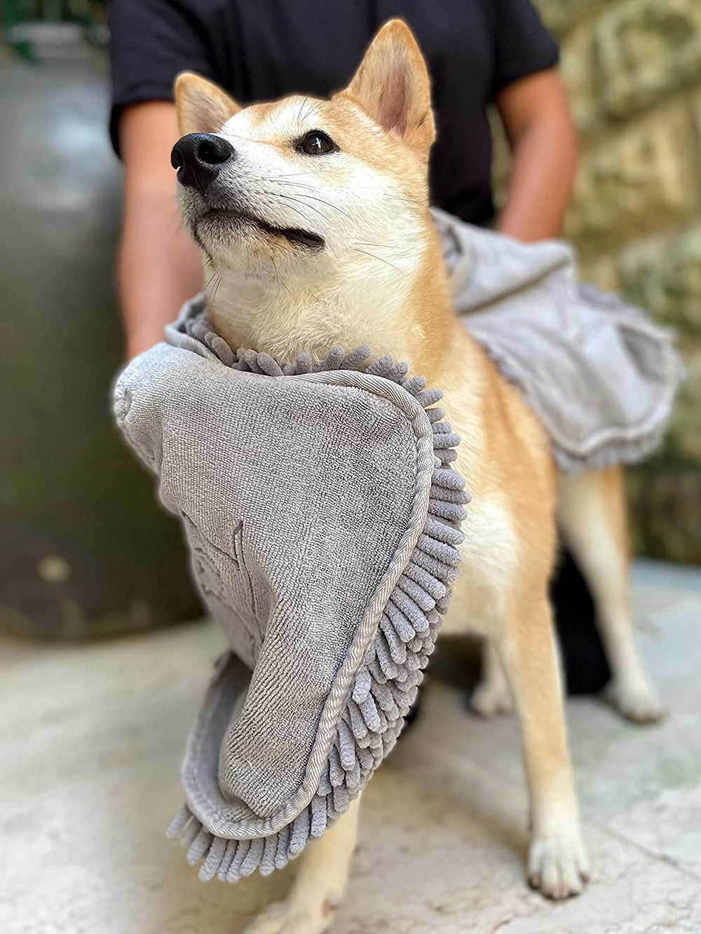 Tuff Pupper noodles massage and wick water from fur for a gentle dry.