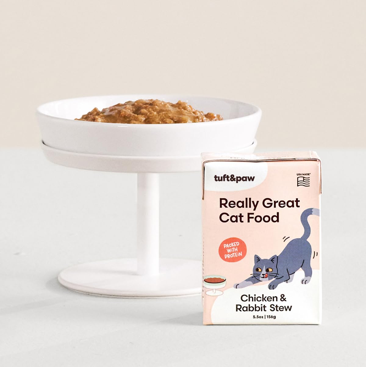 TUFT + PAW Really Great Cat Food can label shows pumpkin and salmon oil for coat health.