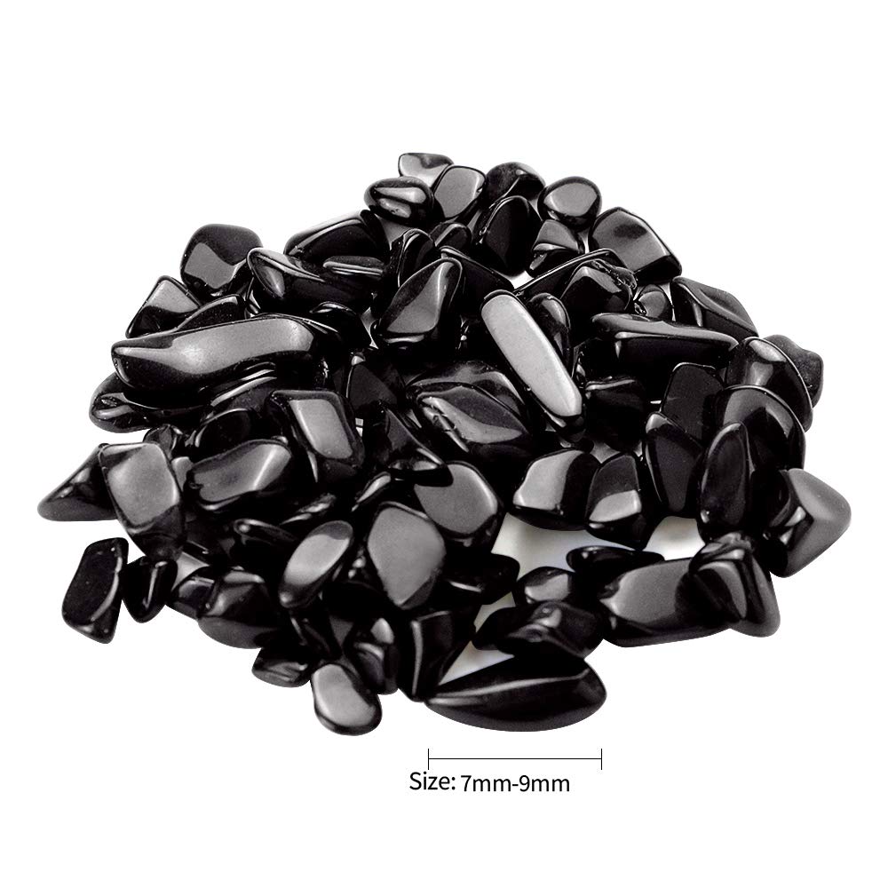 Twdrer black obsidian chips in plant pot arrangement for natural texture and moisture management.