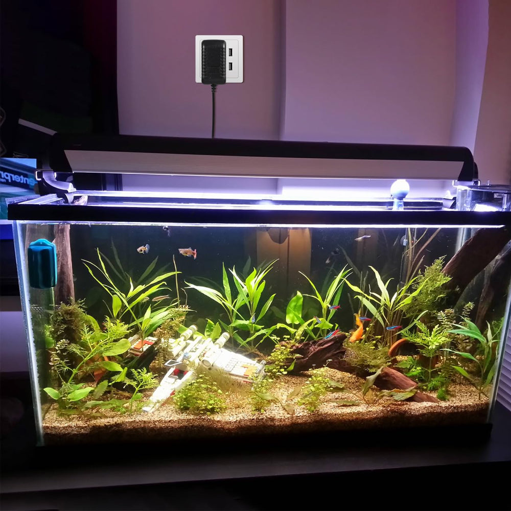 UEETEK adapter powering aquarium LED setup with stable output.