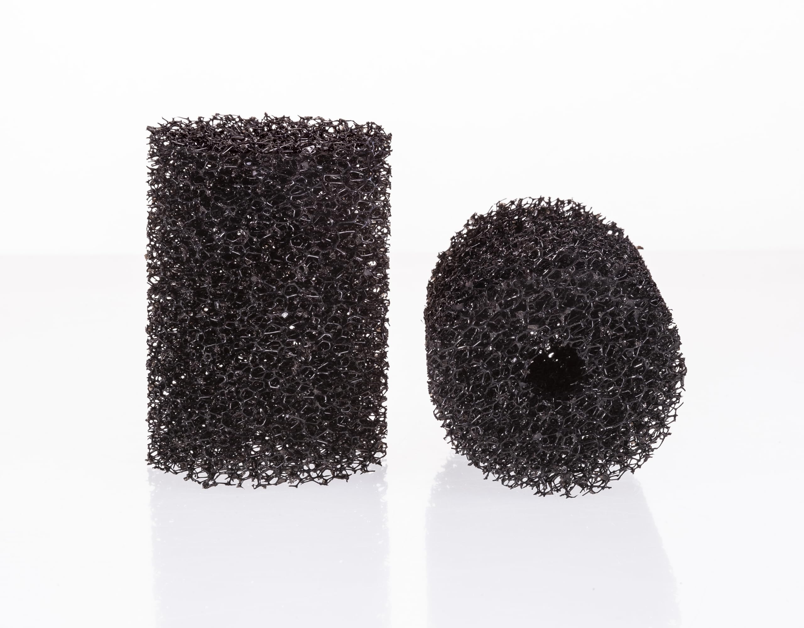 UNEAK two-pack pre-filter sponge over aquarium intake for debris control.