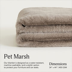 UnHide Lil’ Pet Marsh blanket on couch demonstrates furniture protection and pet comfort.