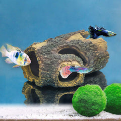 Uniclife resin hollow tree trunk betta log reveals multiple cave holes for small fish.