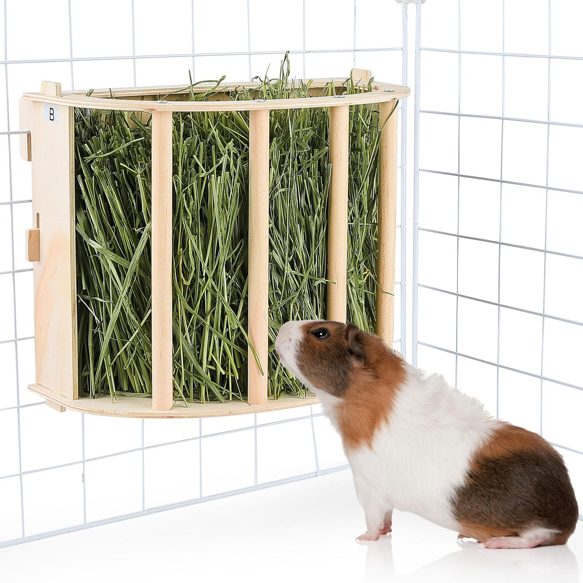 Unicorn Catcher guinea pig hay feeder hanging wooden design keeps hay tidy and accessible.