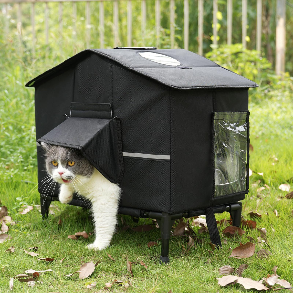 Veehoo outdoor cat house weatherproof front view highlights elevated bed for dry warmth.