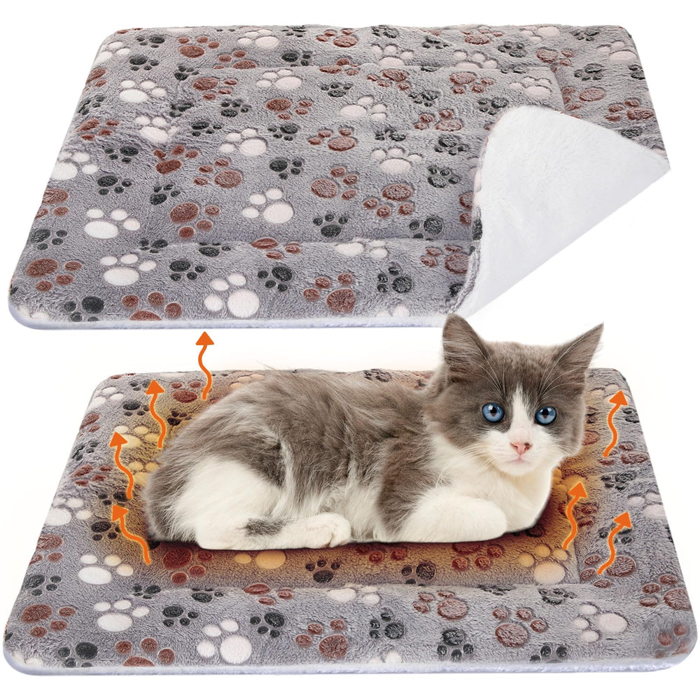 VitalCozy self-warming cat mat on crate keeps pets warm without electricity.