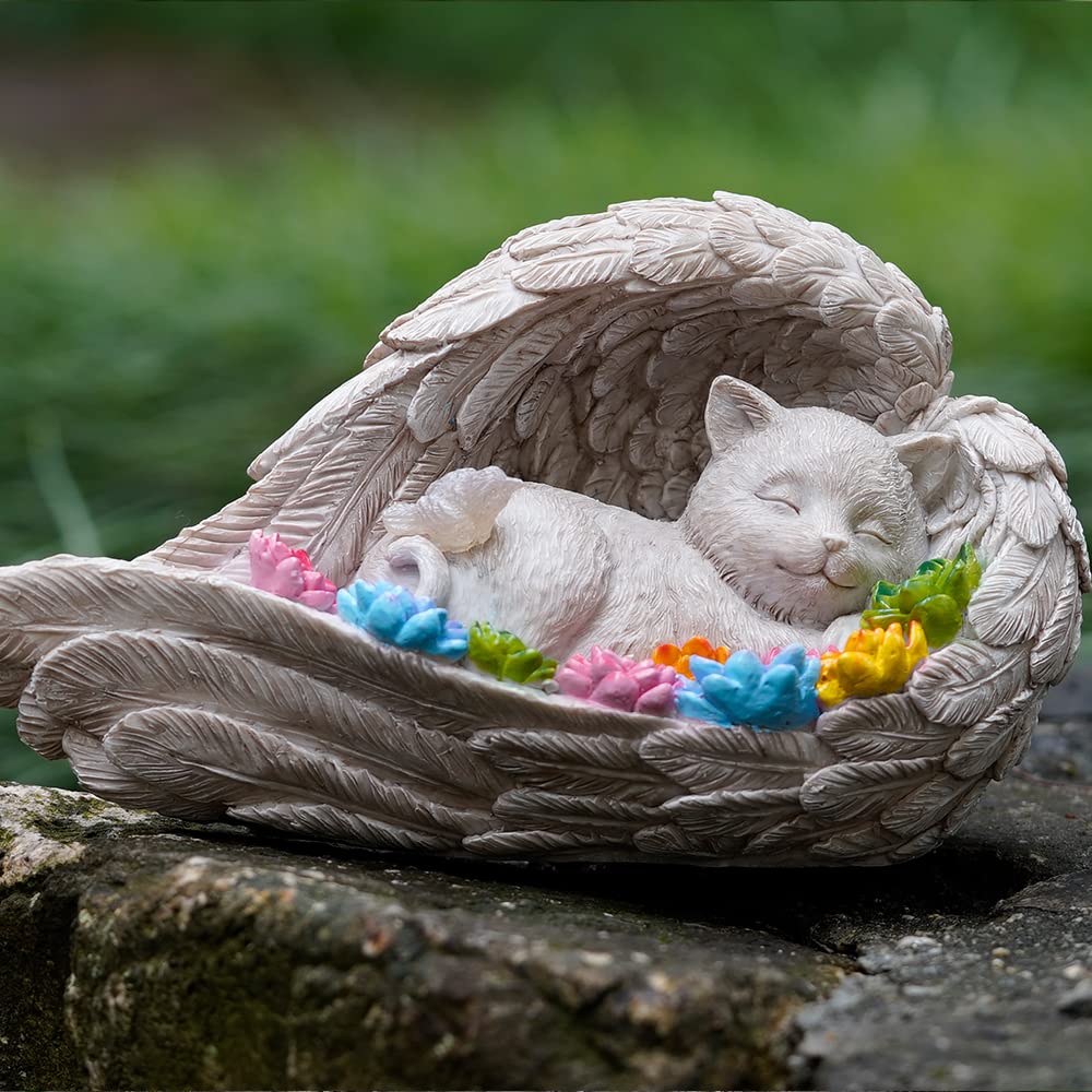 VKEVOC solar-lit angel cat statue glowing softly at sunset